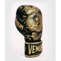 Venum Dragon's Flight boxing gloves black / gold