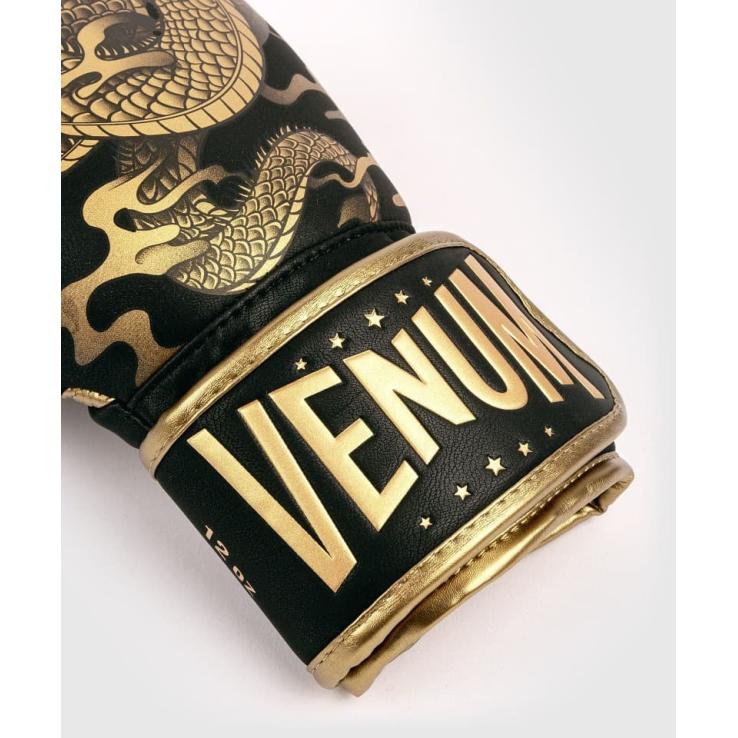 Venum Dragon's Flight boxing gloves black / gold